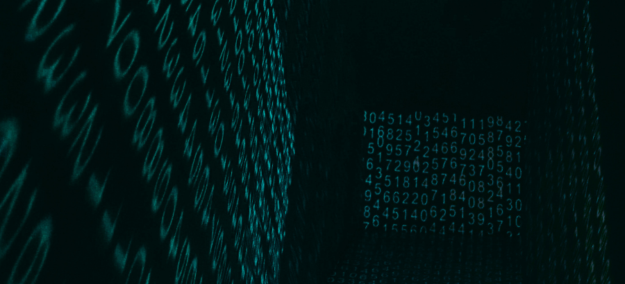 Green code of letters projected on to a wall
